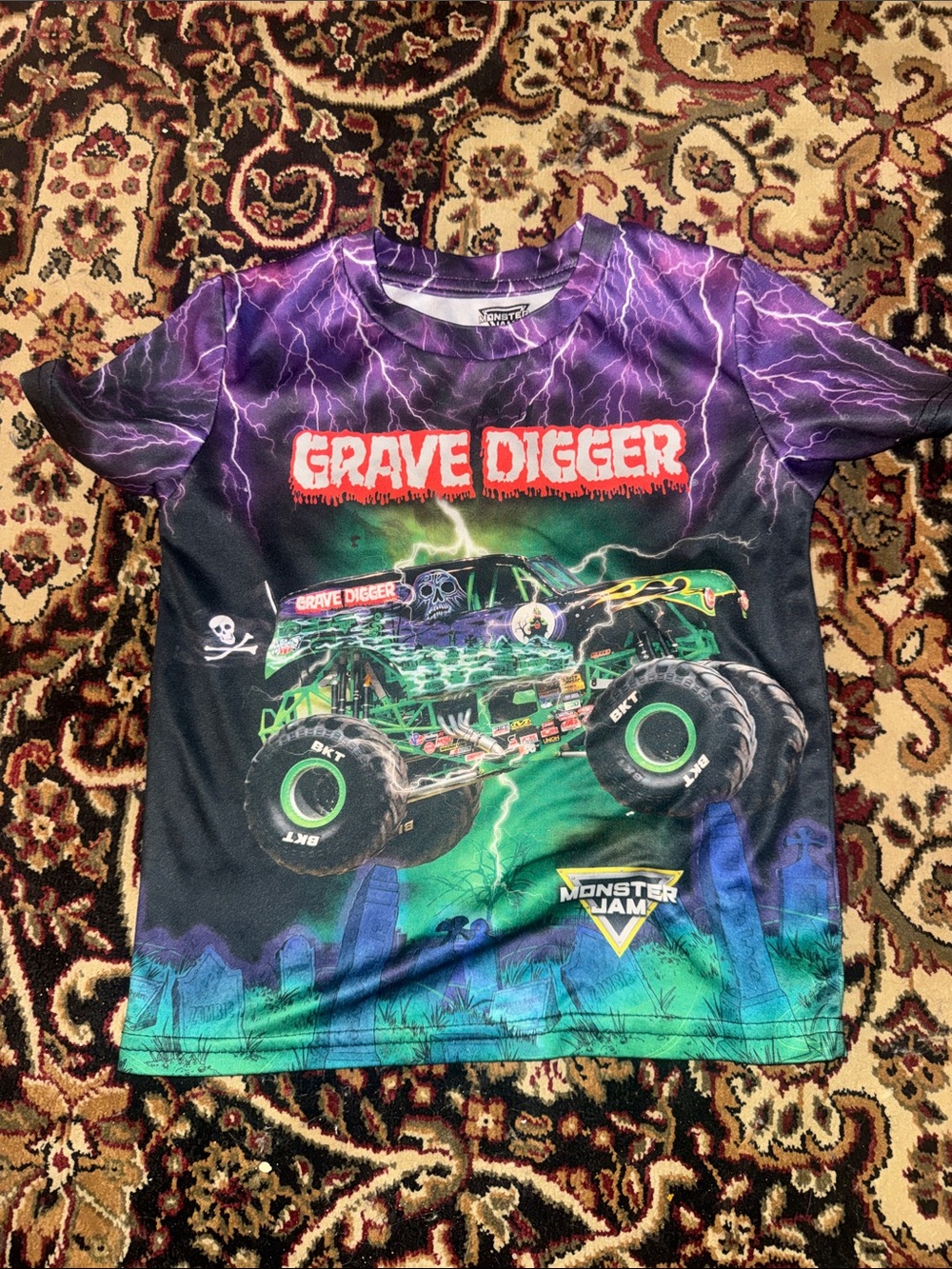 Kids size 5T official Grave Digger Monster Jam Graphic Tee - Purple & Green